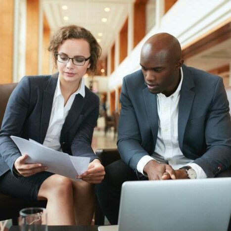 Hotel staff training courses in action: a sales manager coaching a new hotel sales executive during onboarding